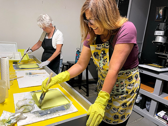 Collective Members Barbara and Andrea coating paper World Cyanotype Day