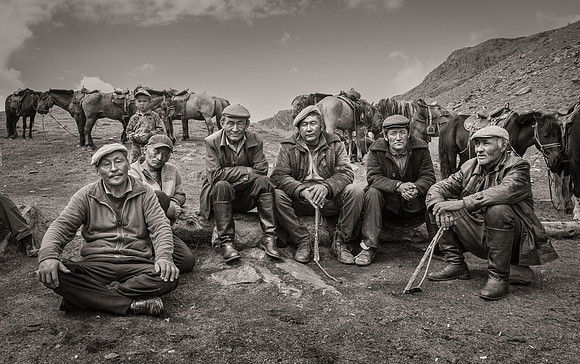 "Men and Boy by Horse Stables, Mongolia"